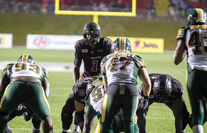 Henry Burris lines up against Edmonton Eskimos